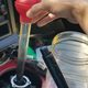 Turkey baster was all I could think of to remove the nasty old oil! It worked!